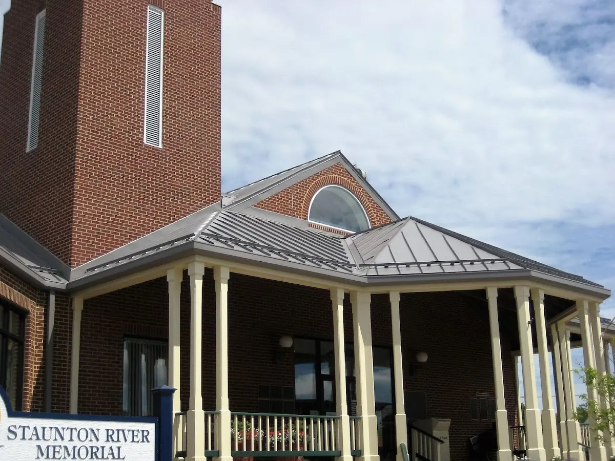 Skilled roofing craftsmen working on a residential roof in Navesink